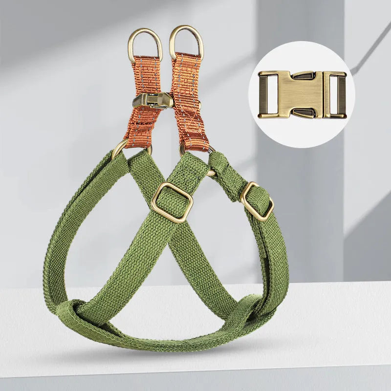Brown vest-style dog harness on small dog showing cotton belt material and alloy fastener