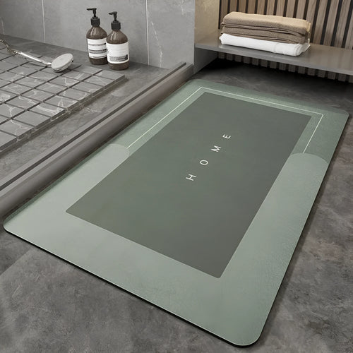 Blue oval blended fabric bathroom floor mat on a tiled floor
