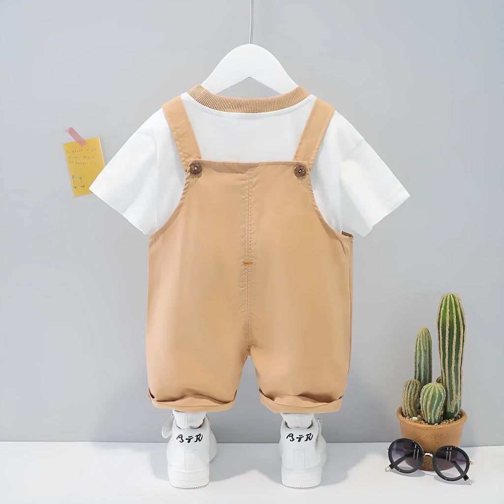 Yellow children's cotton short-sleeved overalls with cartoon print and detachable straps.