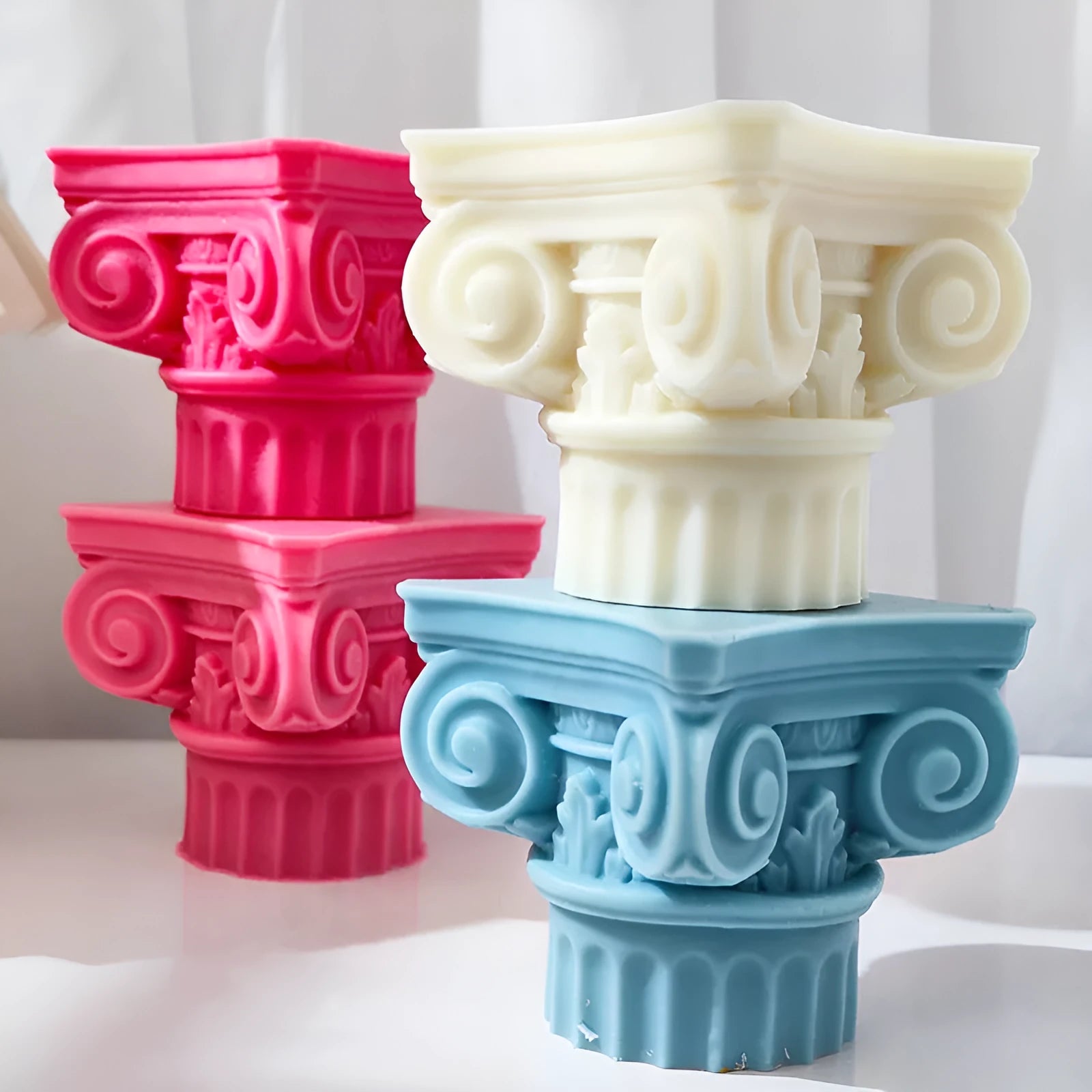 Flexible silicone Roman pillar candle mould on a white background