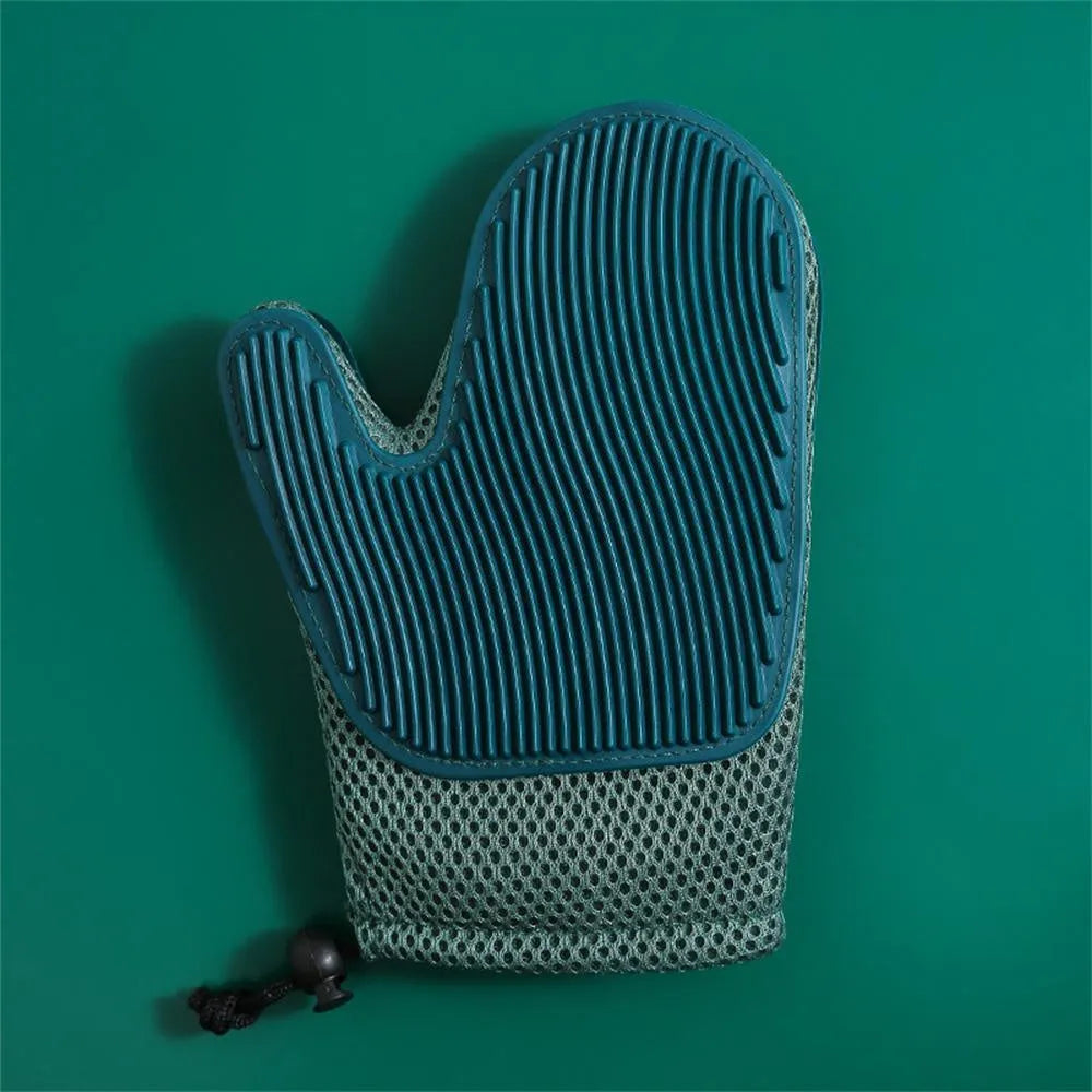 Dark blue pet hair removal glove with mesh surface for grooming dogs and cats and cleaning furniture.