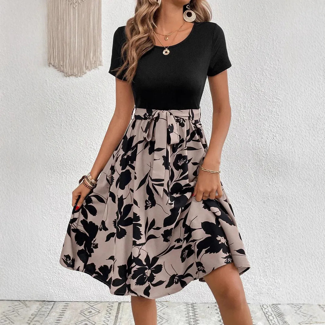 Women's khaki floral print lace-up A-line dress with shoulder straps on a hanger.