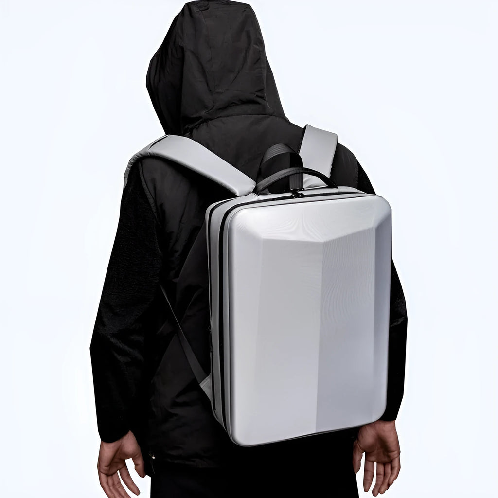Black waterproof Oxford cloth business backpack with curved shoulder straps showing splicing design details