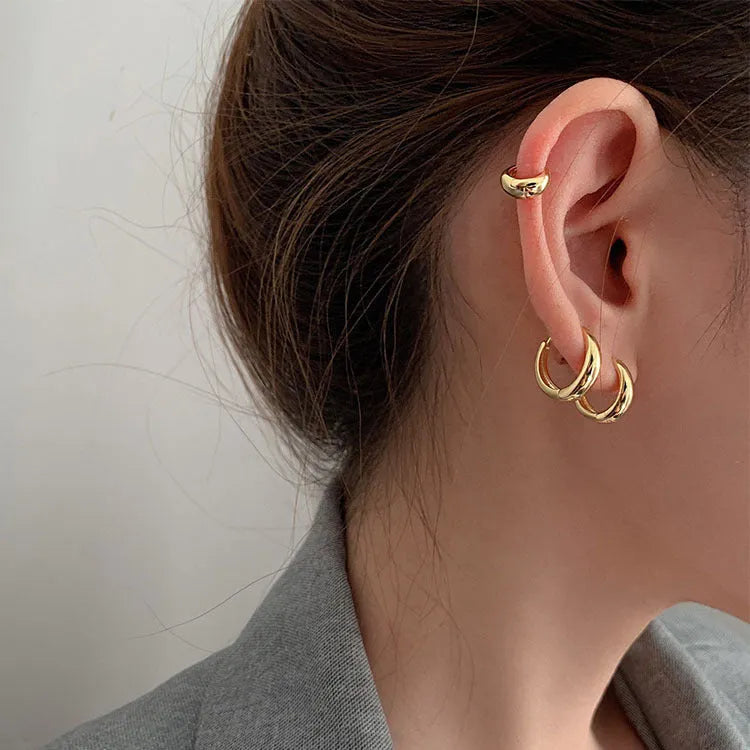 Women's retro minimalist geometric water drop earrings in gold and silver, shown in large, medium, and small sizes.