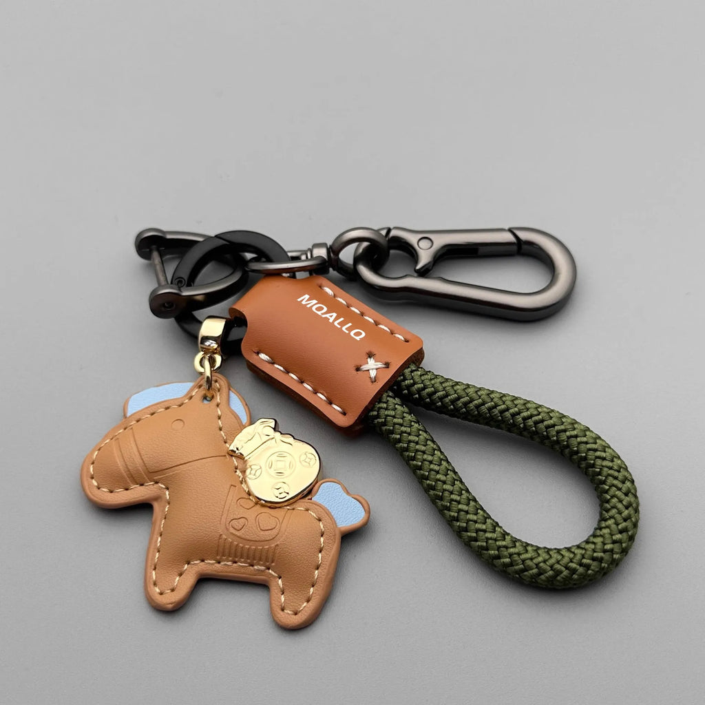 Handmade brown cowhide car key pendant with green flanelle rope and a metal buckle.