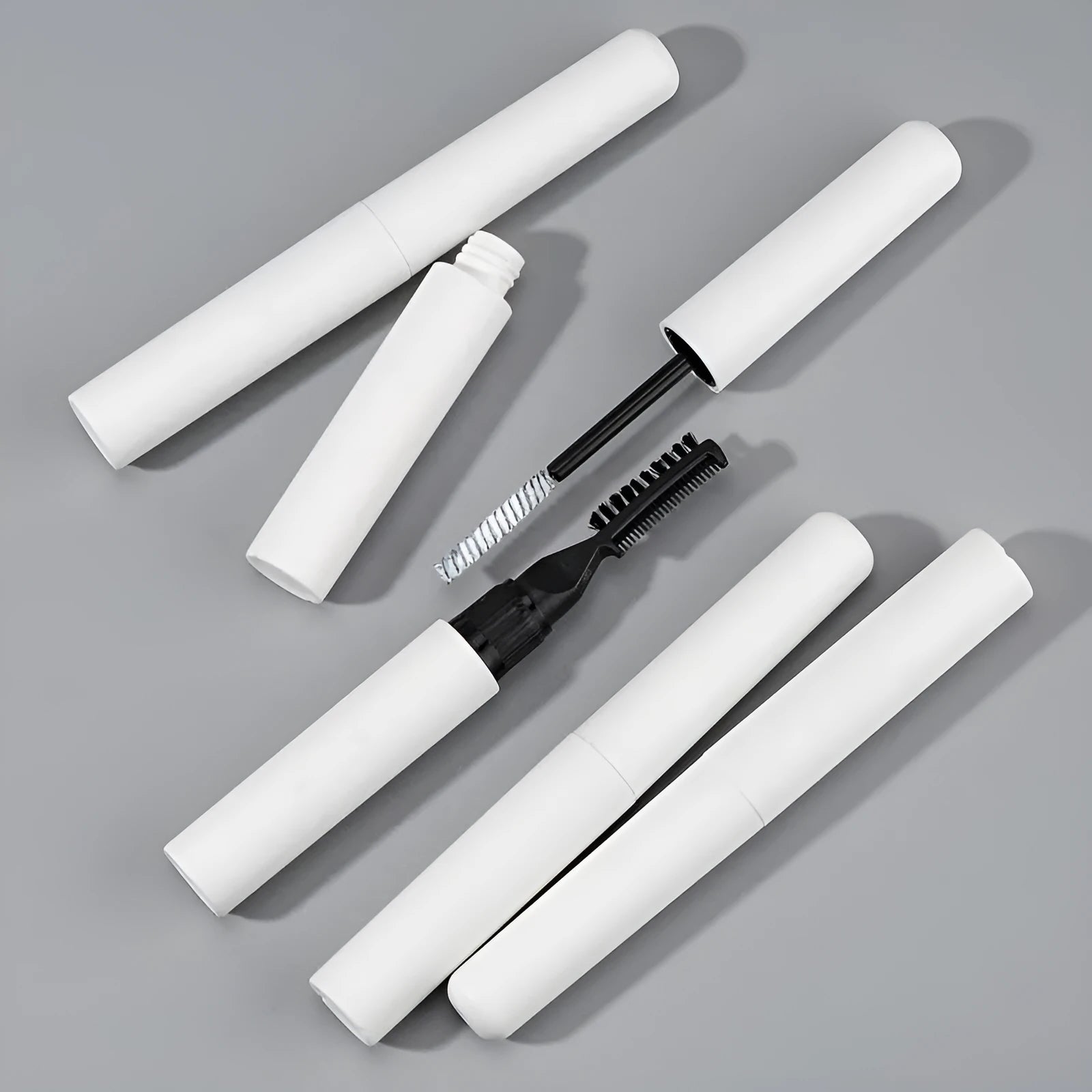 Eyebrow shaping glue and brush set for natural wild brows in white or pink packaging