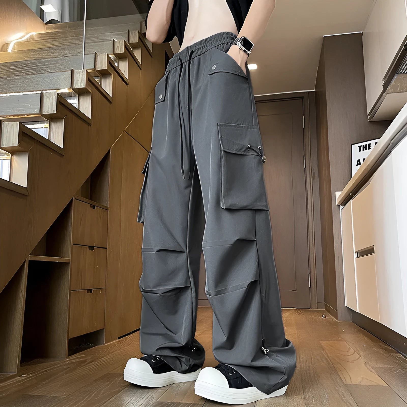 Waterproof loose straight-leg trousers in plus sizes, shown in black, grey, and white.