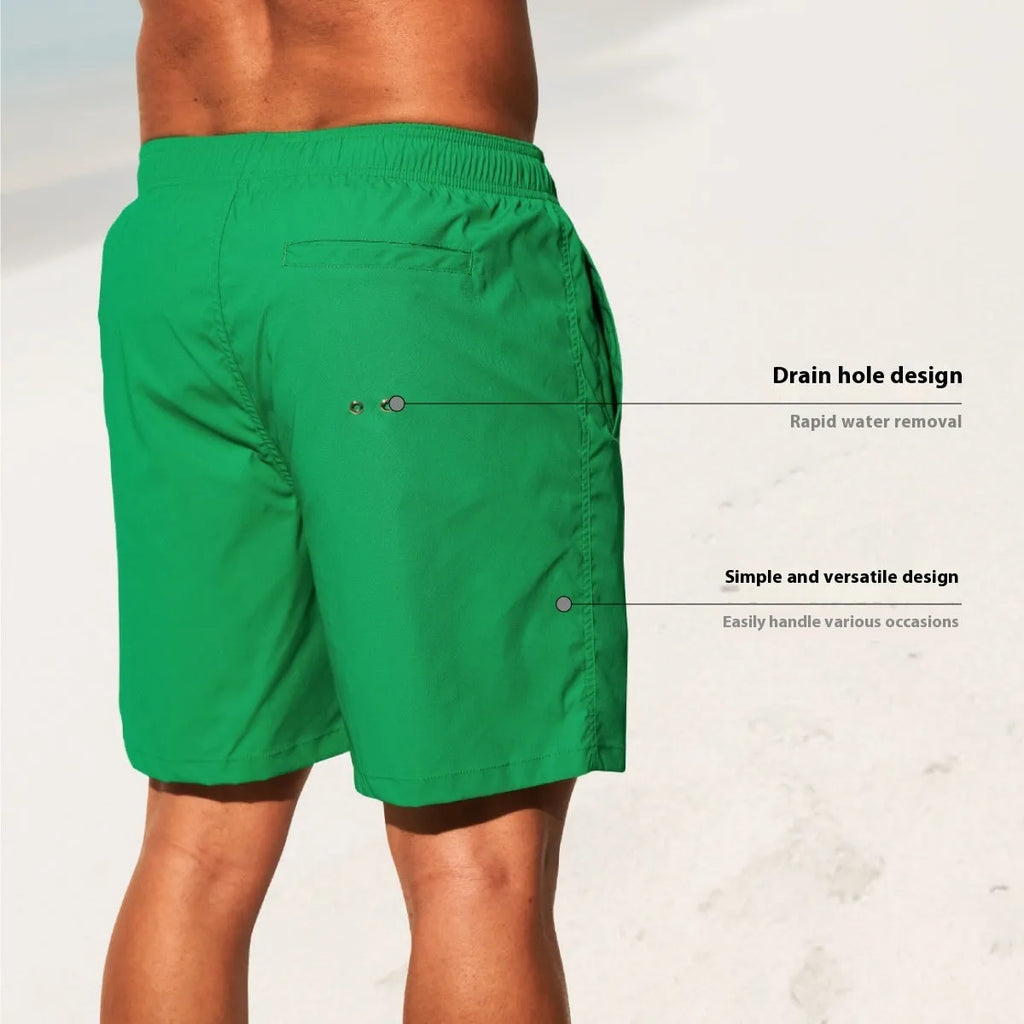 Men's quick-drying nylon sports shorts in green, shown with straight leg and elastic waist.