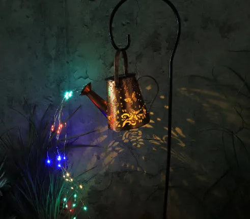 Solar garden lamp with tapered butterfly iron design and warm white LED light