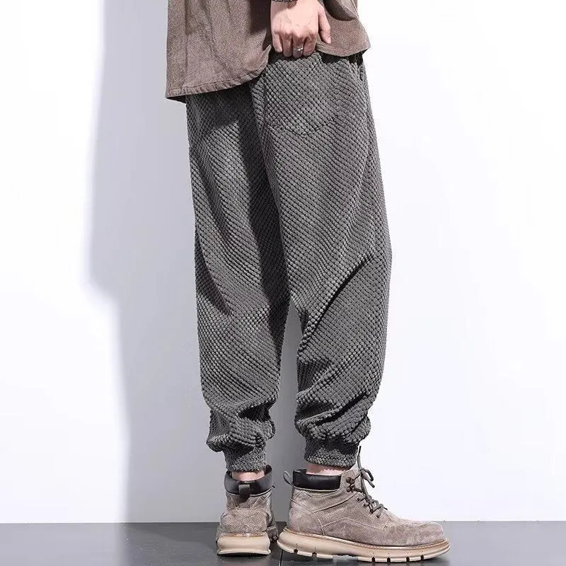 Grey men's straight leg sweatpants with an ankle strap tie detail