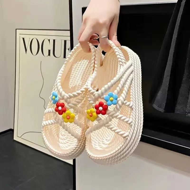 Women's beige PVC sandals with sunflower design, round toe and non-slip sole.