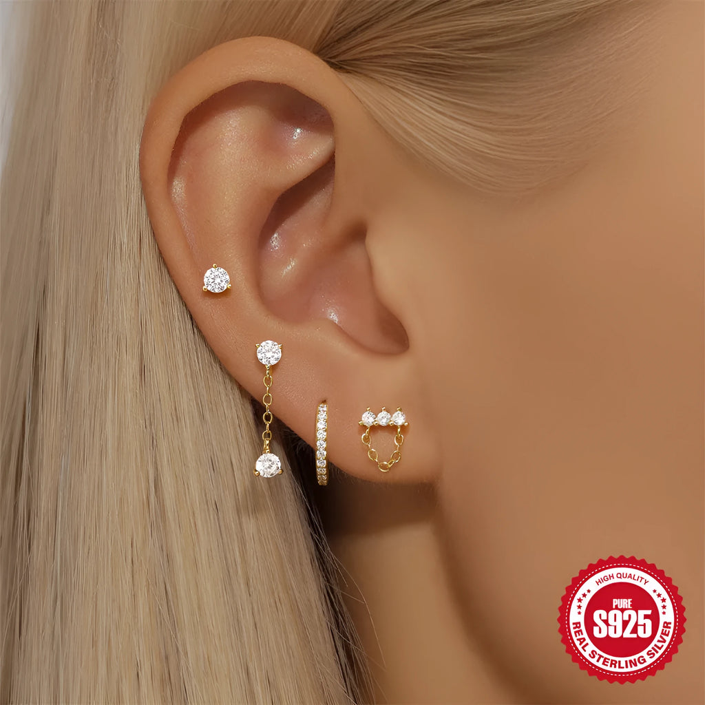 A pair of geometric clover petal earrings made of S925 sterling silver with a gold electroplated finish.