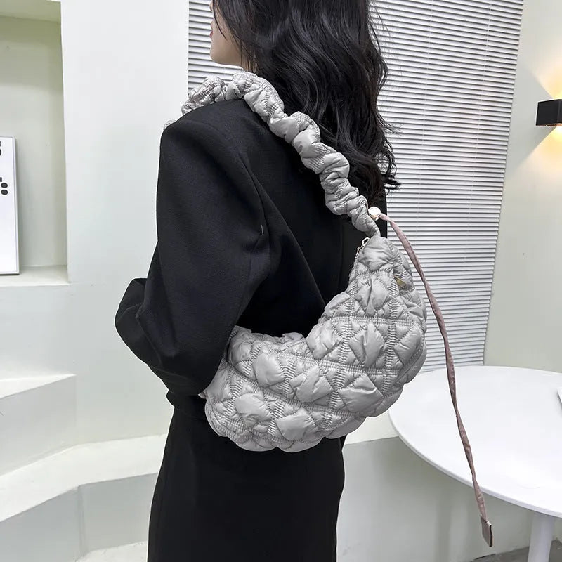Women's nylon shoulder messenger bag in beige colour showing adjustable strap and dimensions