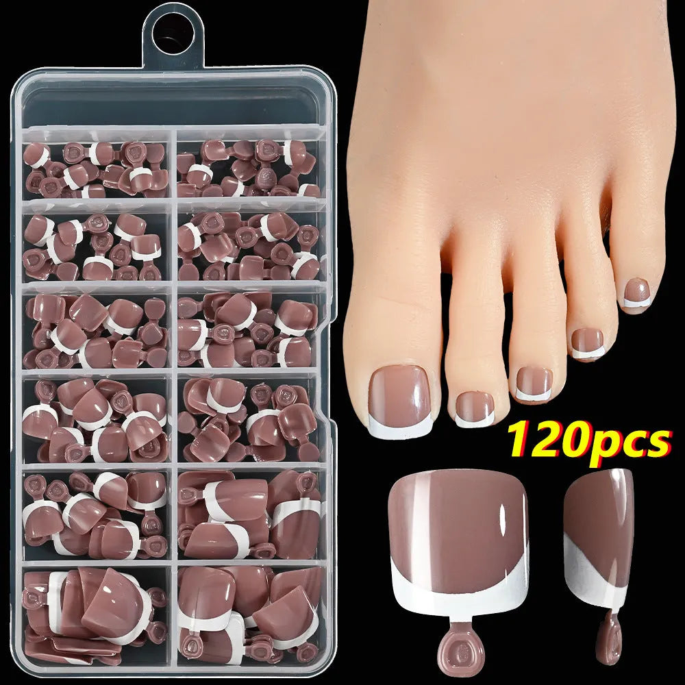 Box of 120 French white edge press-on toe nails in full square short shape showing multiple nude shades.