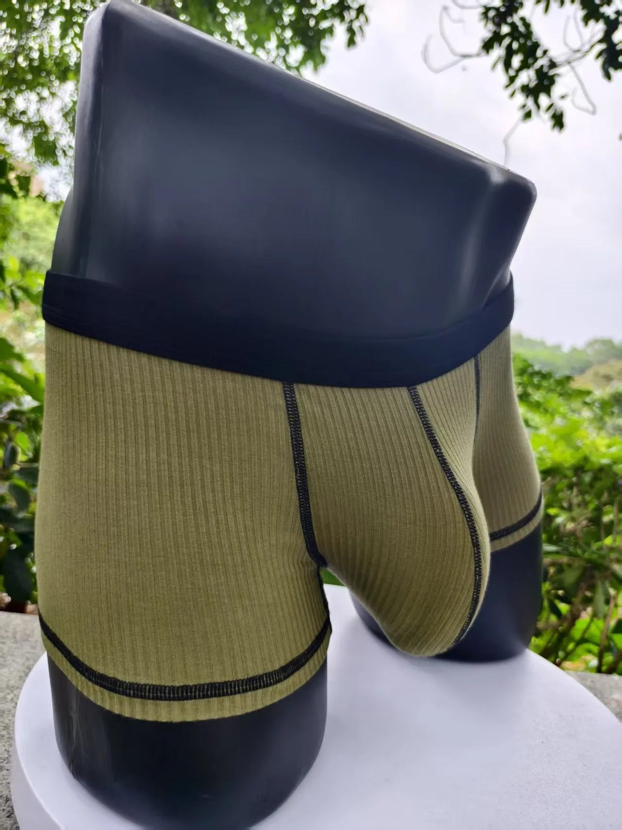Men's solid colour boxer shorts on a white background, showing thin breathable fabric.