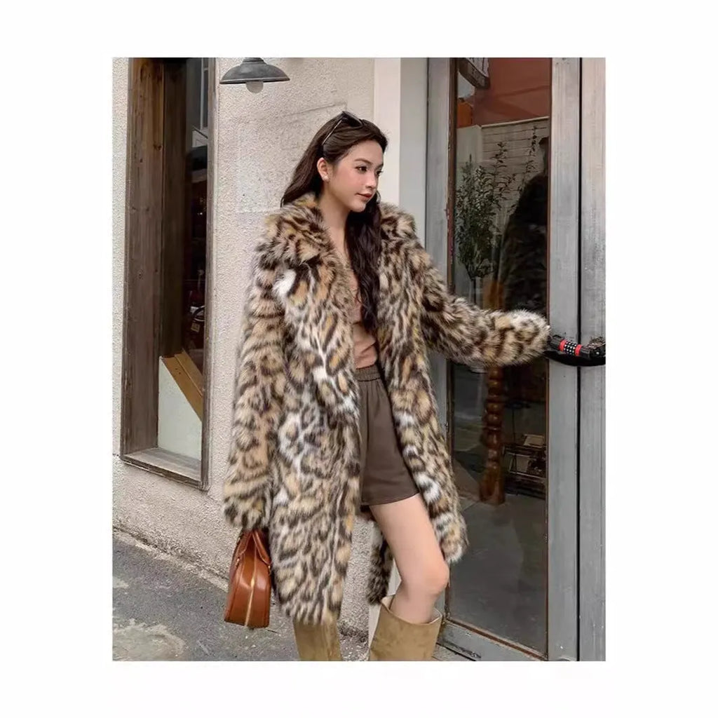 Faux fur coat with fur collar in long or mid-length style showing pocket details