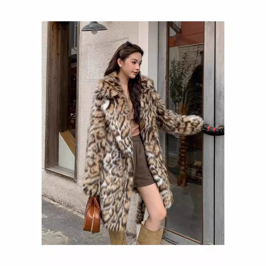 Faux fur coat with fur collar in long or mid-length style showing pocket details