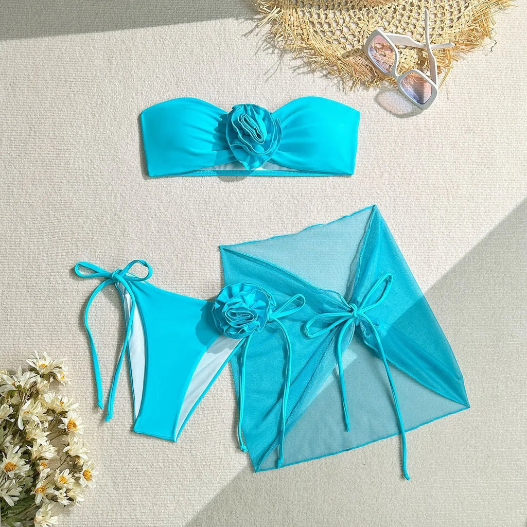 Women's pink swimsuit tube top with three-dimensional flower tie design and matching skirt