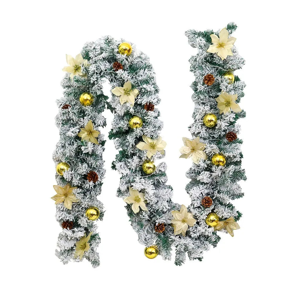 PVC Christmas rattan garland with flocking in golden colour, draped decoratively.