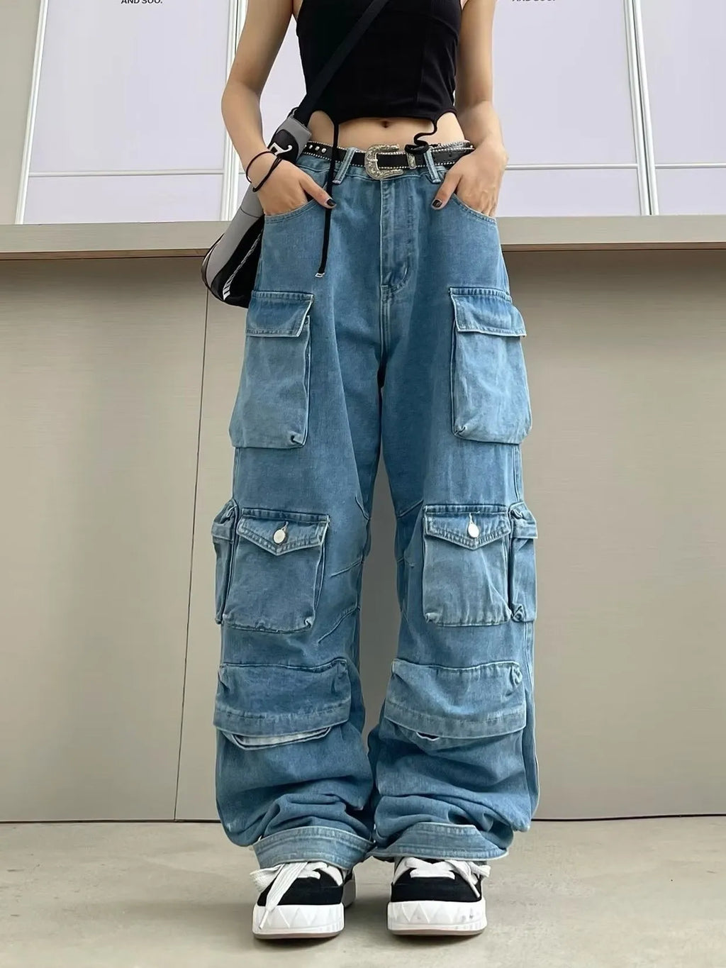 Women's high waist wide leg jeans in street hipster style with multiple pockets