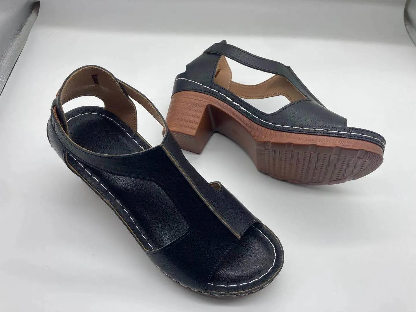 Plus size women's wedge sandals with peep toe, Roman buckle detail, and fish mouth design