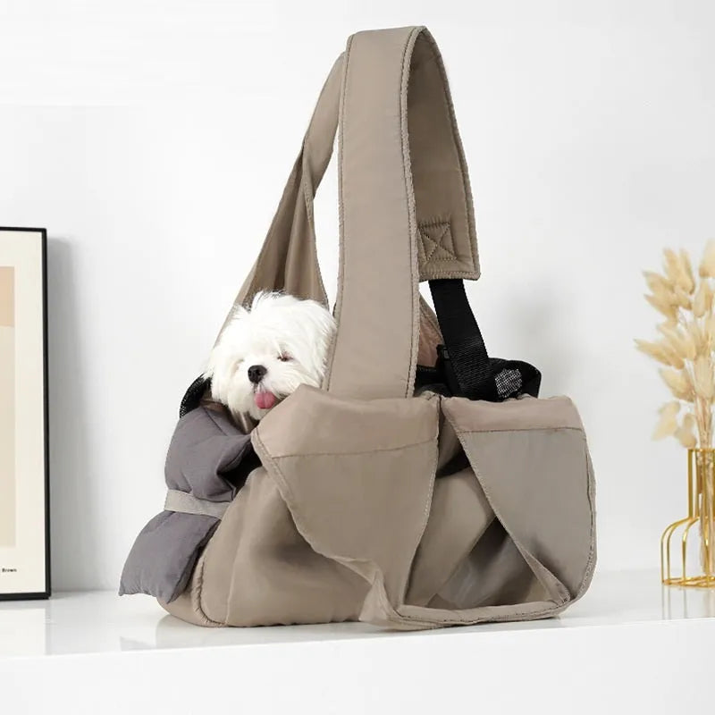Apricot coloured cloth pet handbag carrier with dimensions 41 cm by 16 cm by 28 cm.