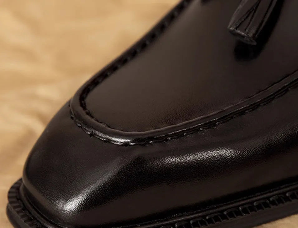 Men's black genuine leather slip-on loafers with fringed design and rubber sole