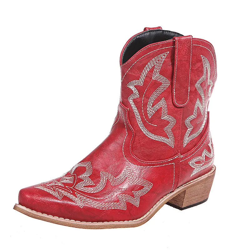Blue women's cowboy ankle boots with embroidery, a pointed toe, and a low wedge heel.