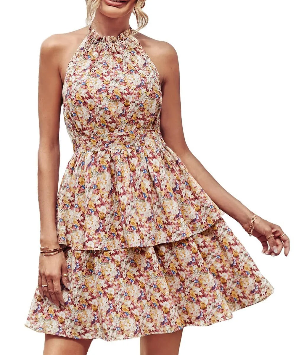 Women's boho-style backless halter dress with ruffled A-line skirt in a printed pattern.