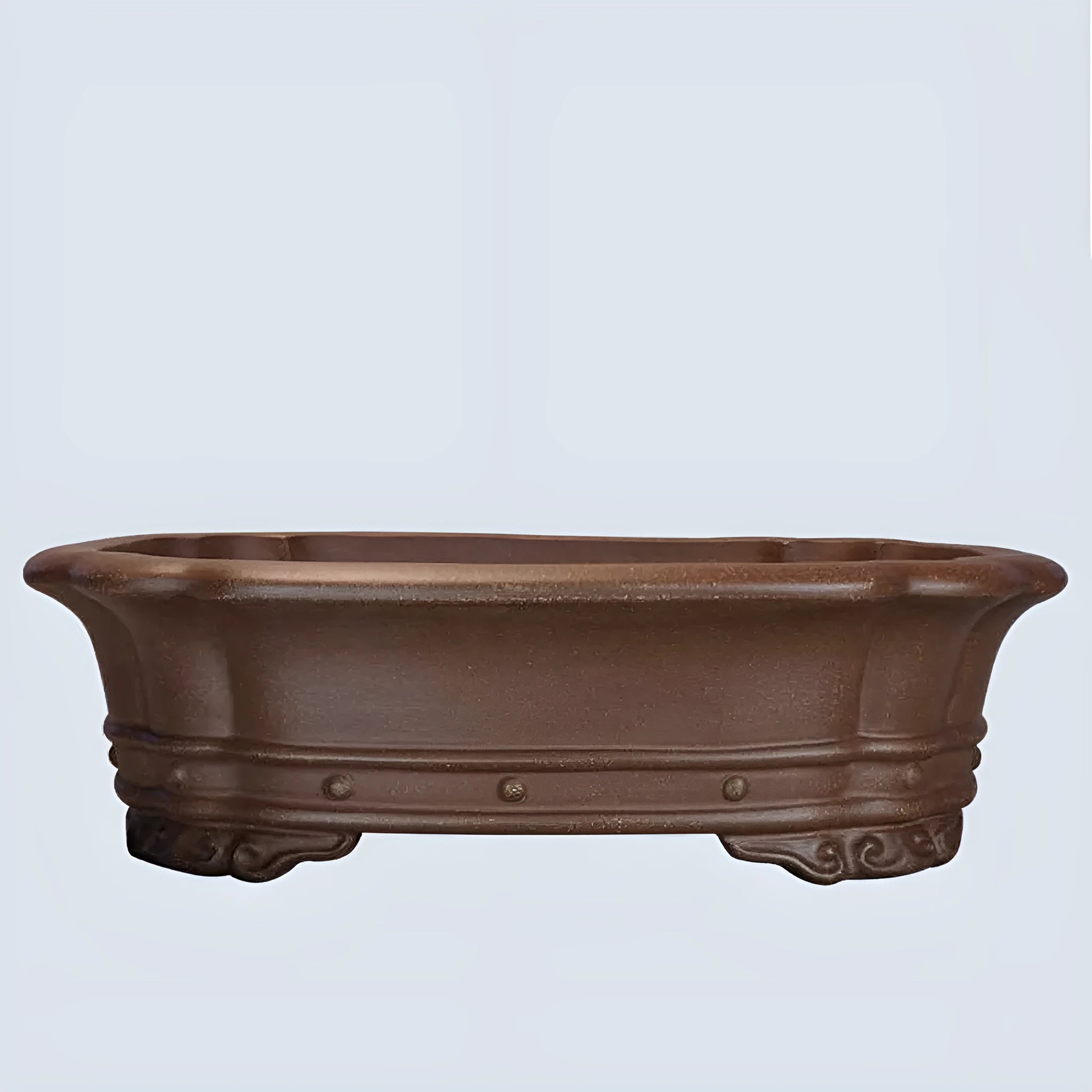 Handmade purple sand antique rectangular flower pot on a desktop.