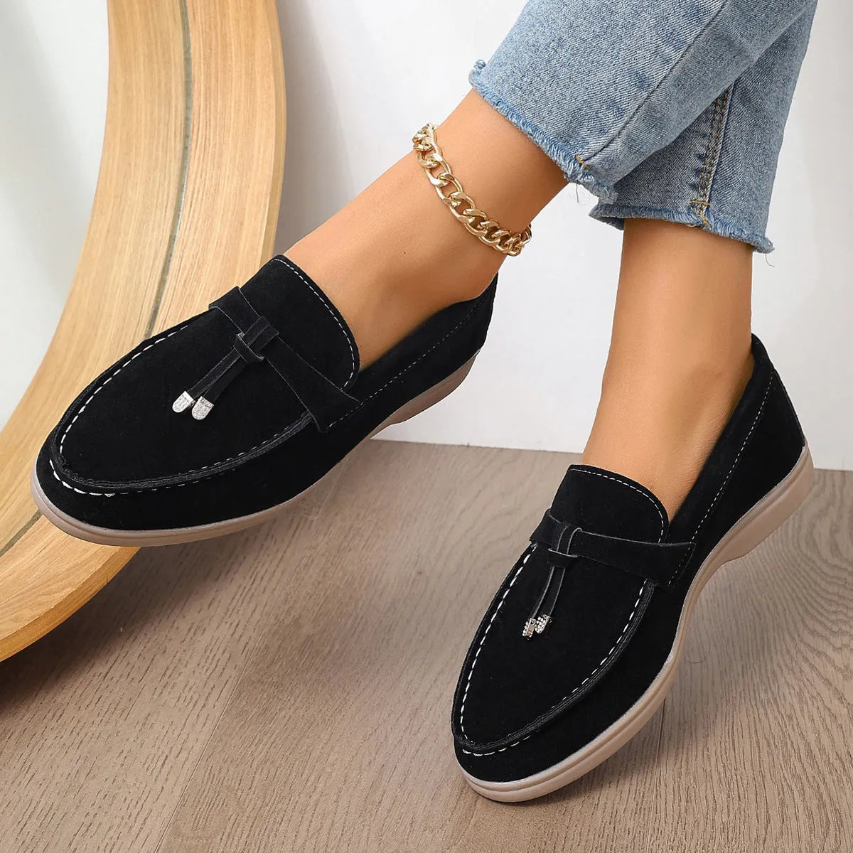 Casual canvas slip-on loafers with a platform heel and round toe in black, apricot, and brown colour options.