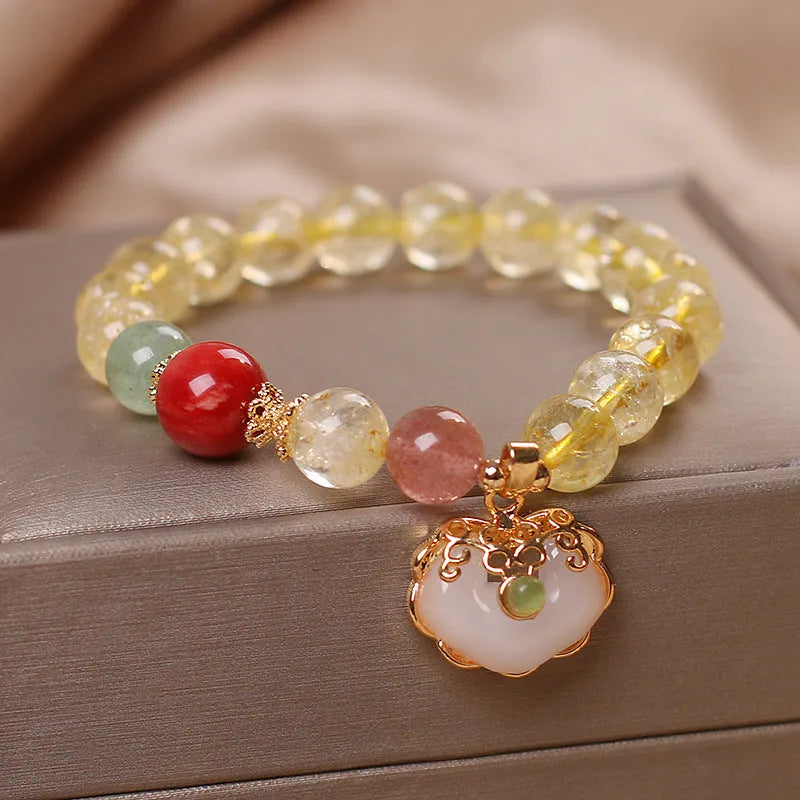 Original design women's alloy bracelet with a natural yellow hair crystal citrine jade ruyi pendant charm.