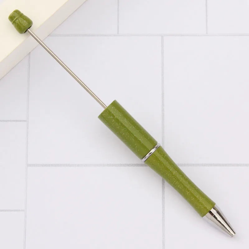 Ballpoint pen with colourful rotating plastic beads on steel wire barrel showing gradient colour options