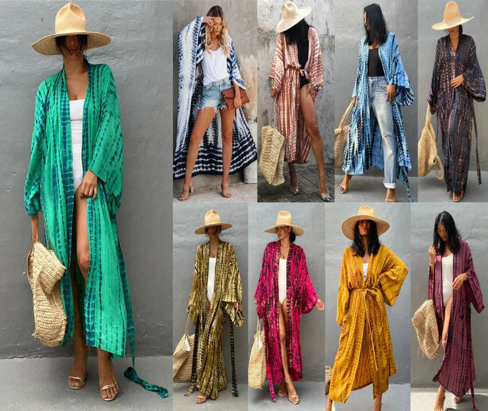 Woman wearing a printed cotton beach cover-up blouse in a DN0712 series colour.