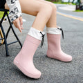 Women's non-slip PVC rain boots in apricot, black, brown and pink colours with wear-resistant soles