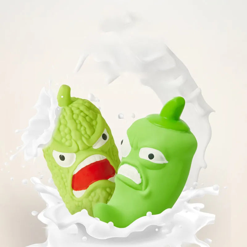 Green bitter melon or red chili shaped dog chew toy with squeaker for dental care and play.