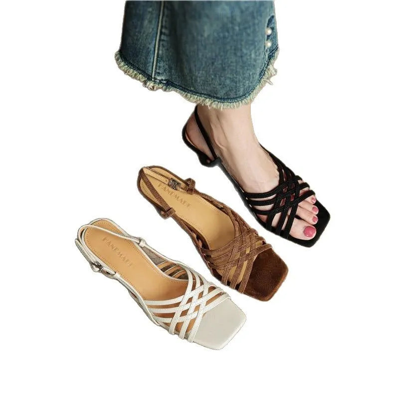 Women's light brown retro high heel sandals with thin cross straps and an ankle buckle on a square toe.