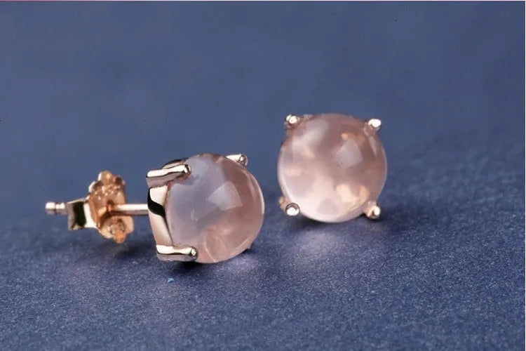 Women's rose gold drop-shaped stud earrings with synthetic Ross quartz and crystal inlay detail