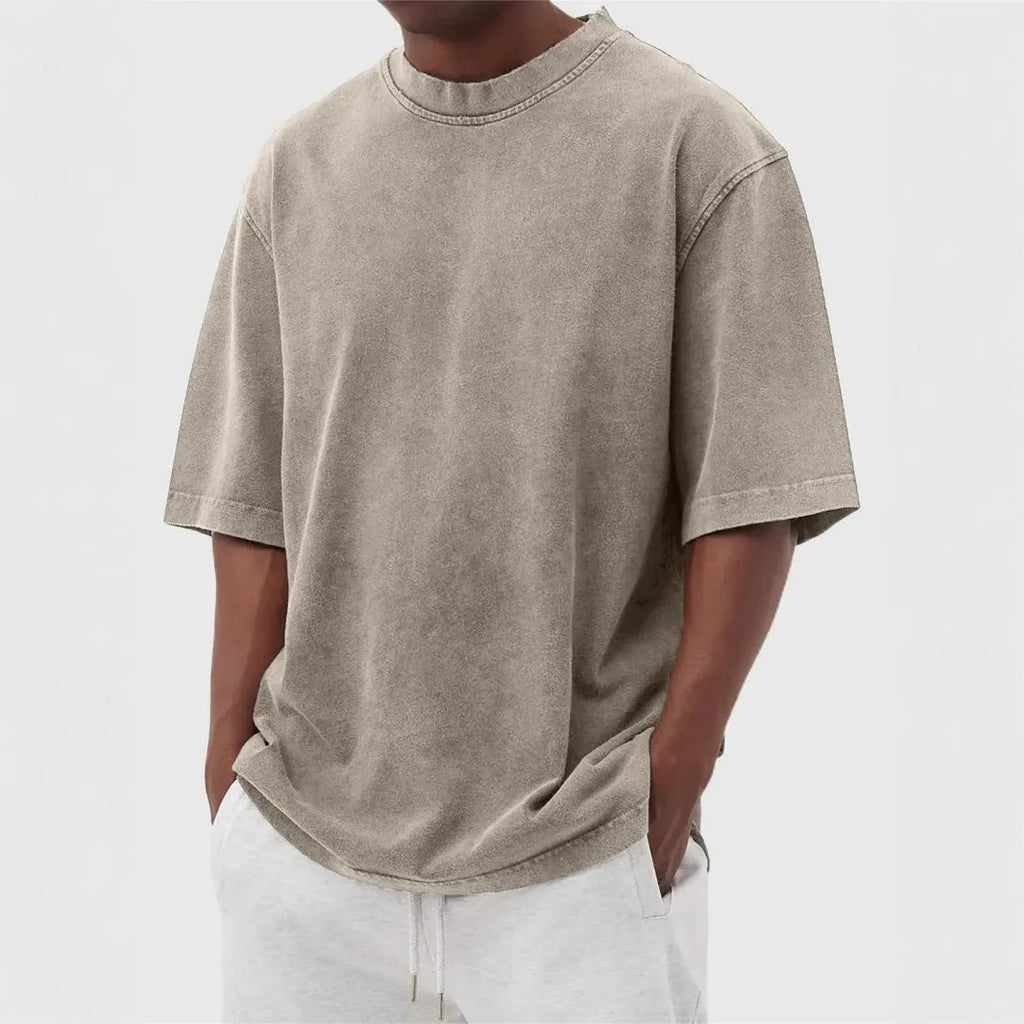 Men's washed distressed pullover t-shirt in solid colour with loose fit and stone washed finish