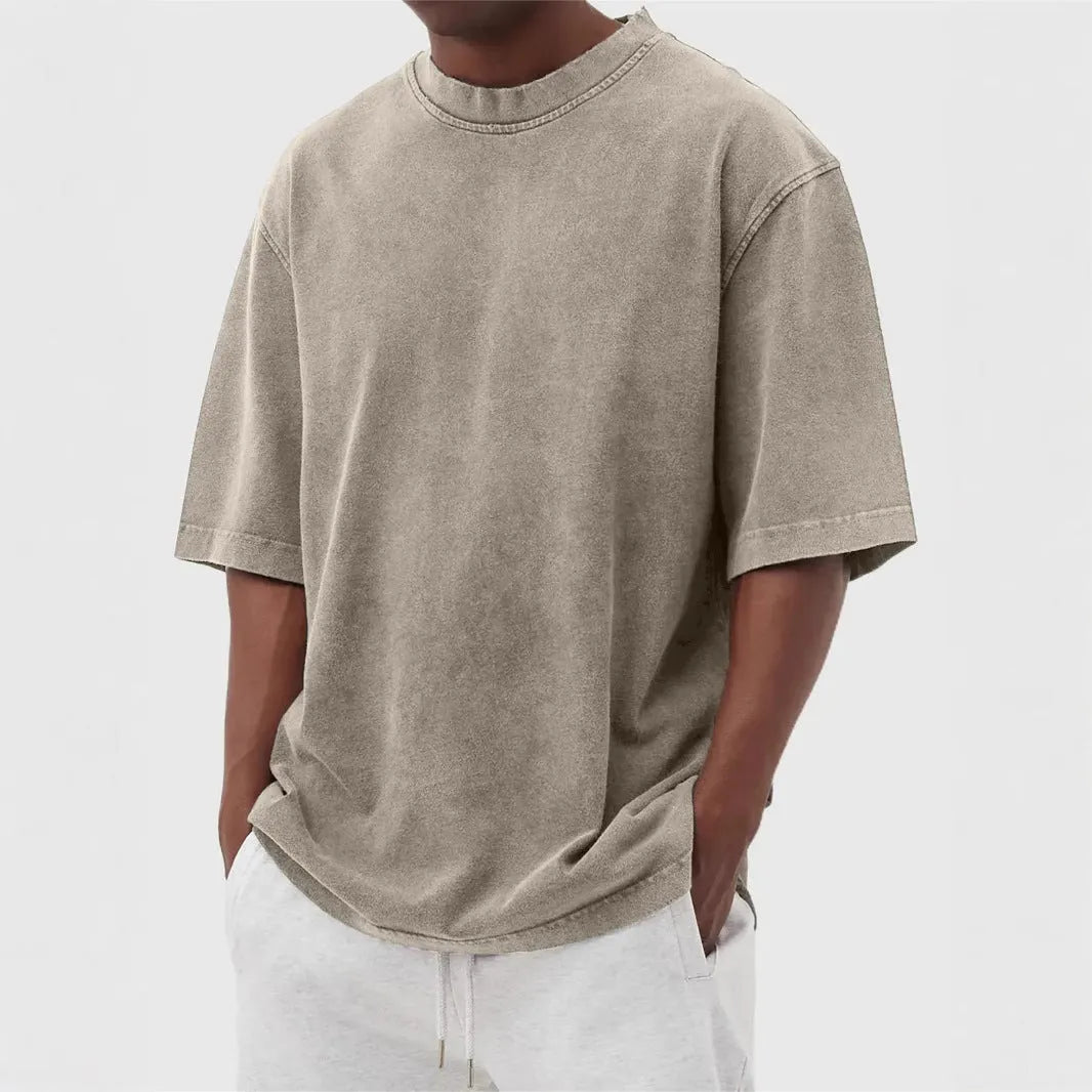 Men's washed distressed pullover t-shirt in solid colour with loose fit and stone washed finish