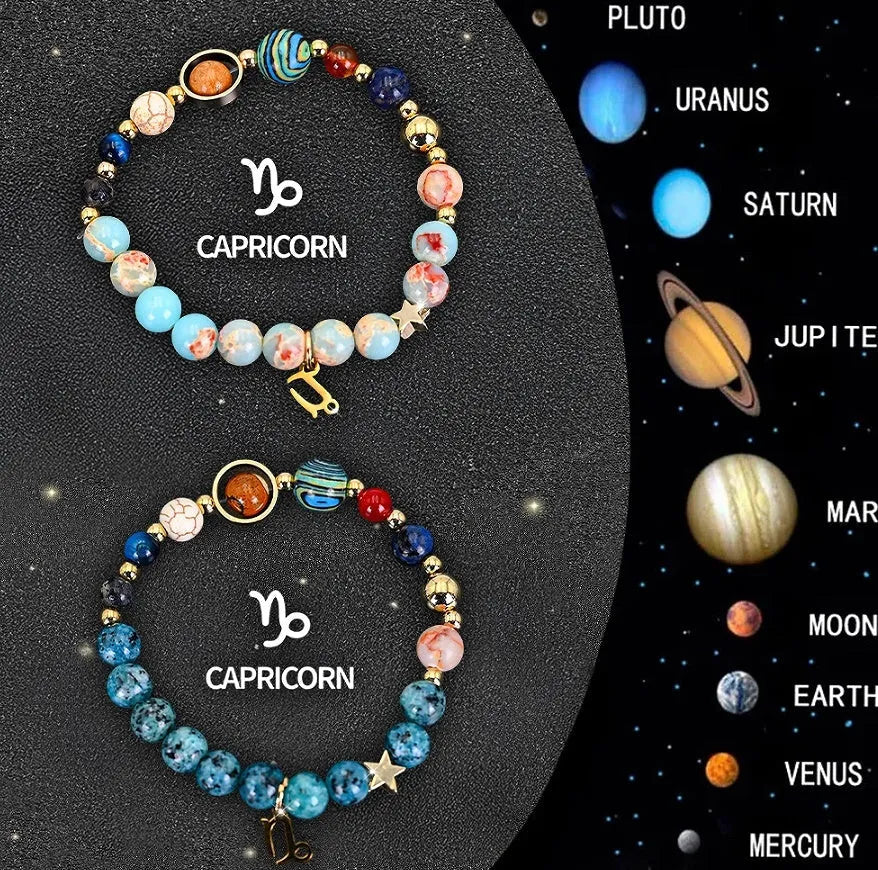 Set of two natural stone beaded bracelets for twelve zodiac signs on a wooden surface.