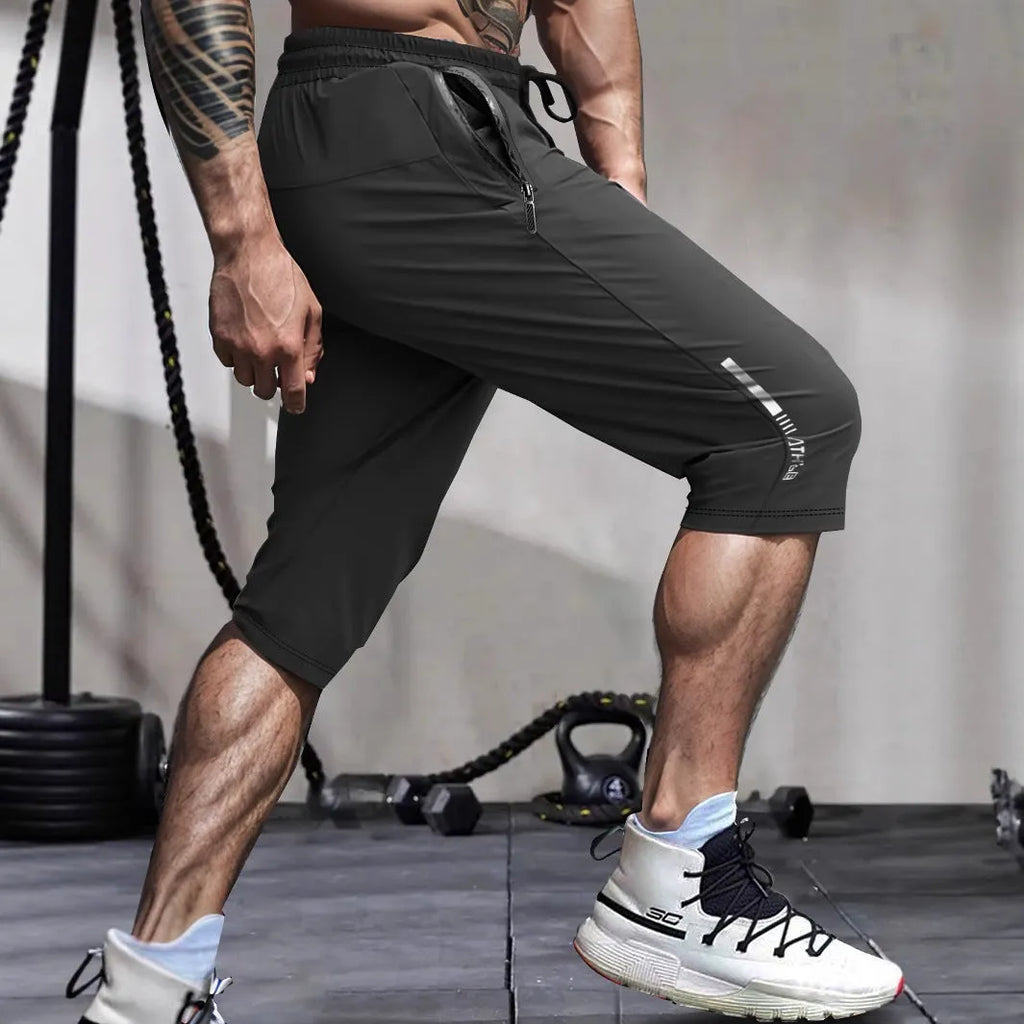 Men's straight-leg cropped sports pants in quick-dry nylon fabric, shown in khaki colour.