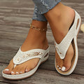 Women's retro-style flip-flop sandals with a herringbone pattern on the strap, shown in a light brown colour.