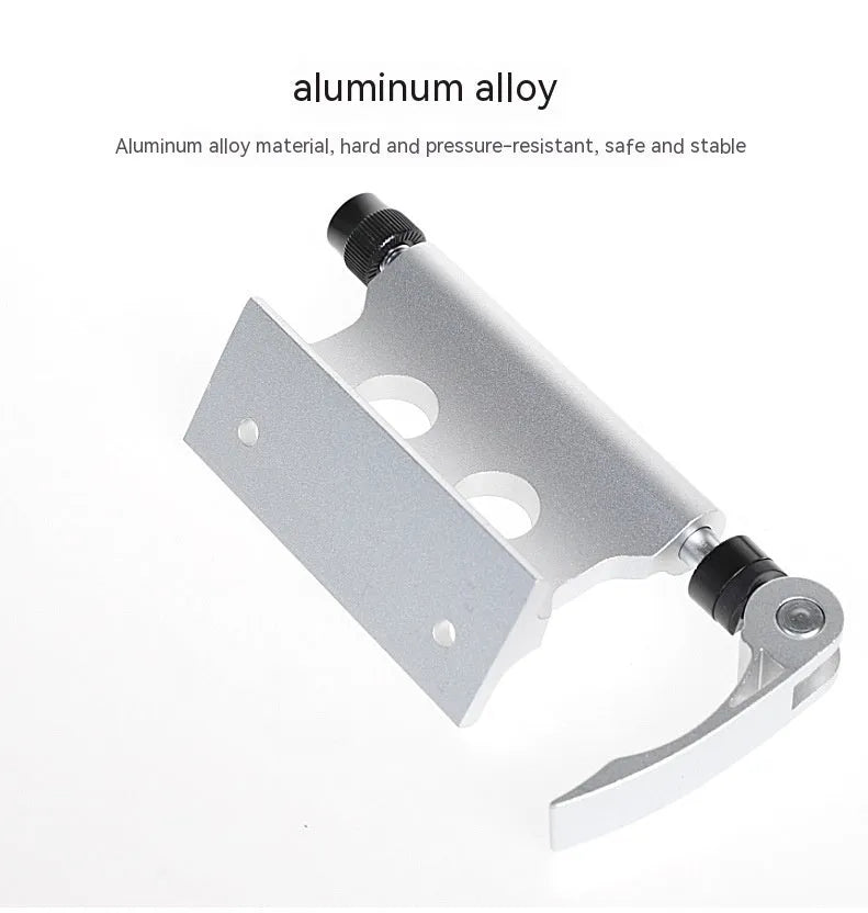 Silver metal quick release clamp for attaching a rack to a bicycle front fork.