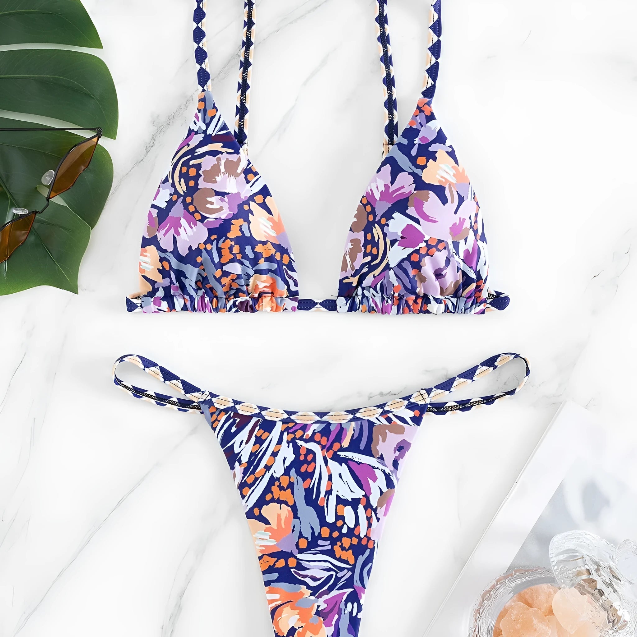 Women's floral printed polyester swimsuit with triangle bag design and briefs style bottom in S, M, L sizes