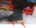 Women's black knight ankle boots with a cross strap design over the instep.
