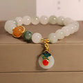 Women's ice jade crystal bracelet with pearl accents and a jade buckle on a white background.