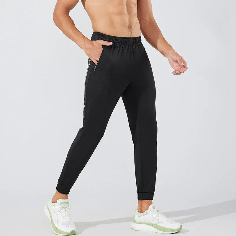 Men's black polyester running trousers with mid waist and full-length sport styling