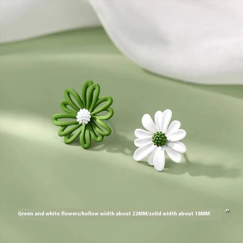 A pair of cartoon-style flower stud earrings in alloy, showing a blue and orange two-tone colour variant.