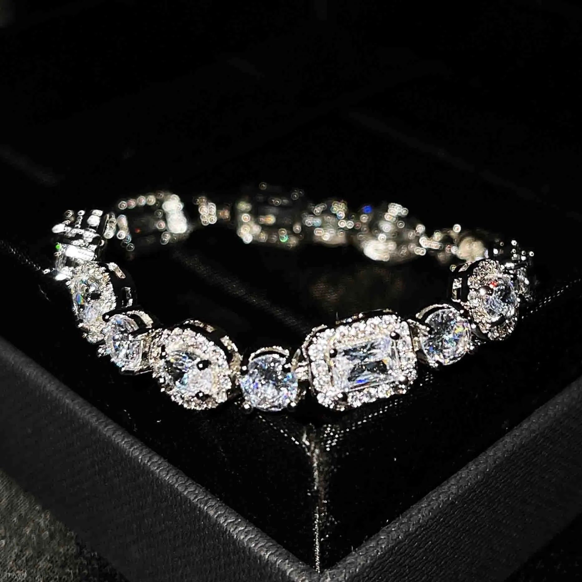 Women's geometric bracelet with silver and white gold plating and sparkling inlaid zircon stones.